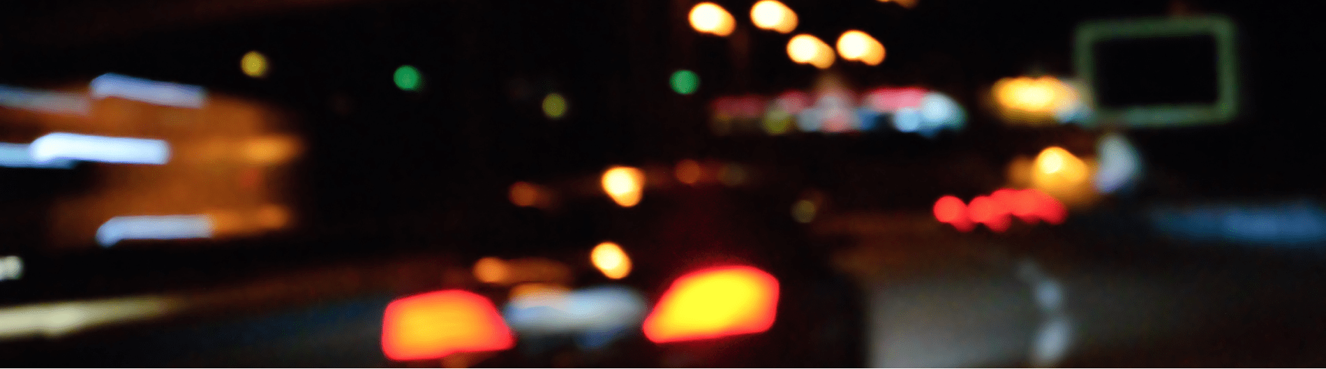 Image showing blurred view of what a drunk driver might see while driving and causing an accident where victims would need a drunk driving accident lawyer